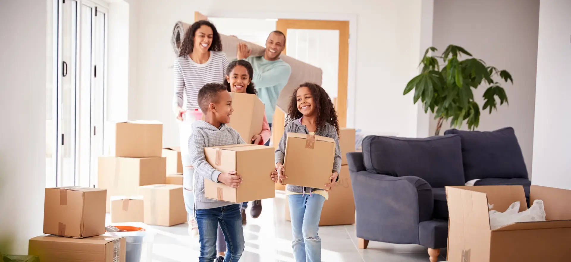 Happy family moving in to their new home thanks to Global Mortgage